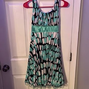 Green black and white polka dot dress